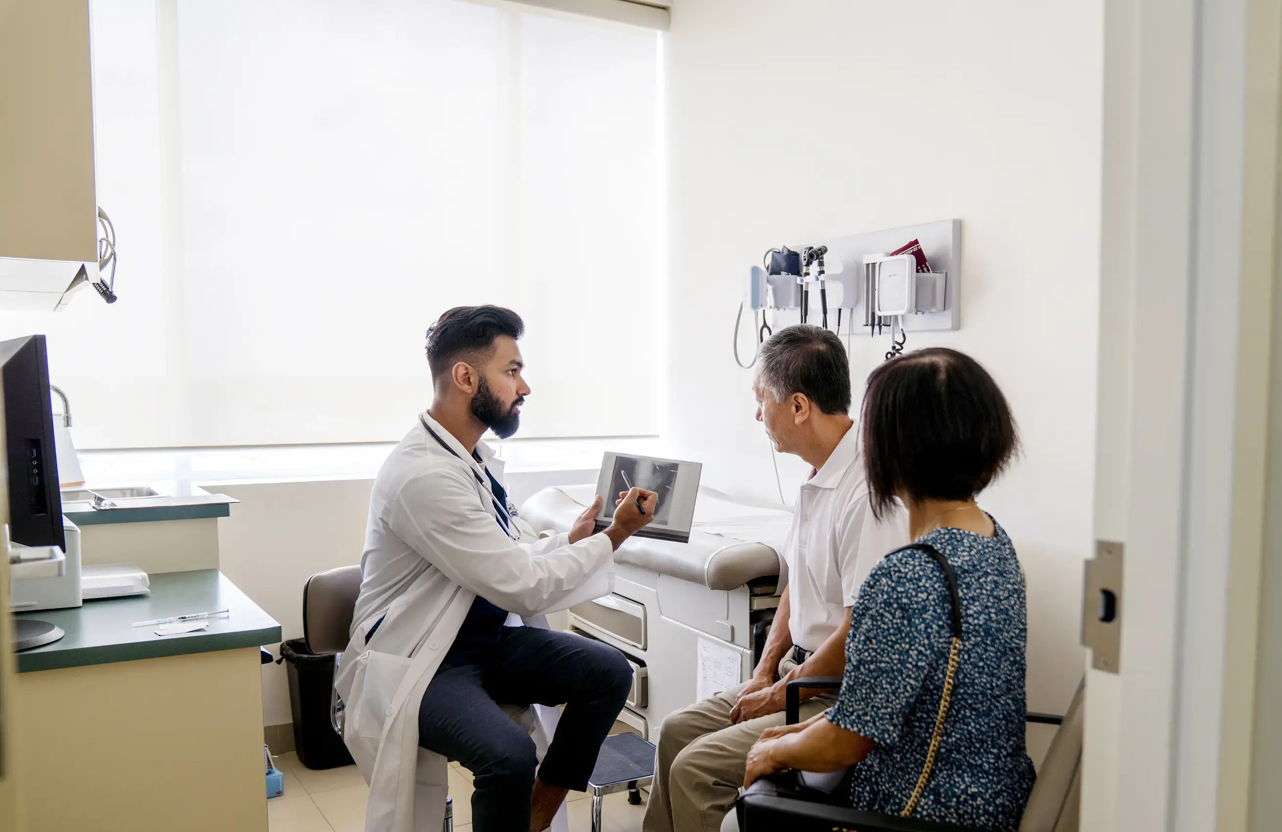 Doctor speaking with patients